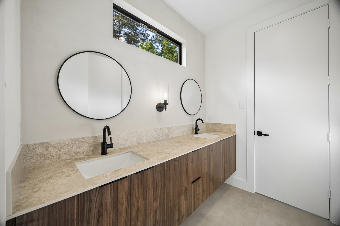 10943 Mockingbird Place Conroe, TX 77385 - Photo 15 of 24 a bathroom with a sink and a mirror