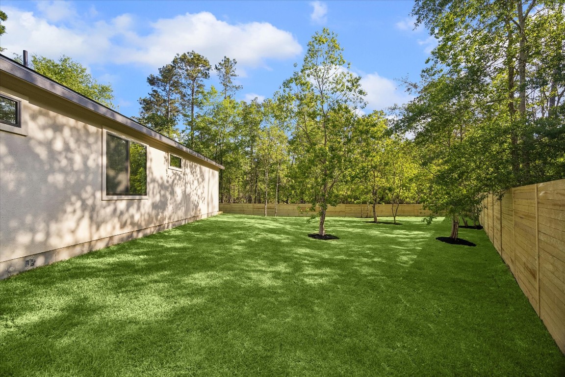 10943 Mockingbird Place Conroe, TX 77385 - Photo 24 of 24 a view of a backyard