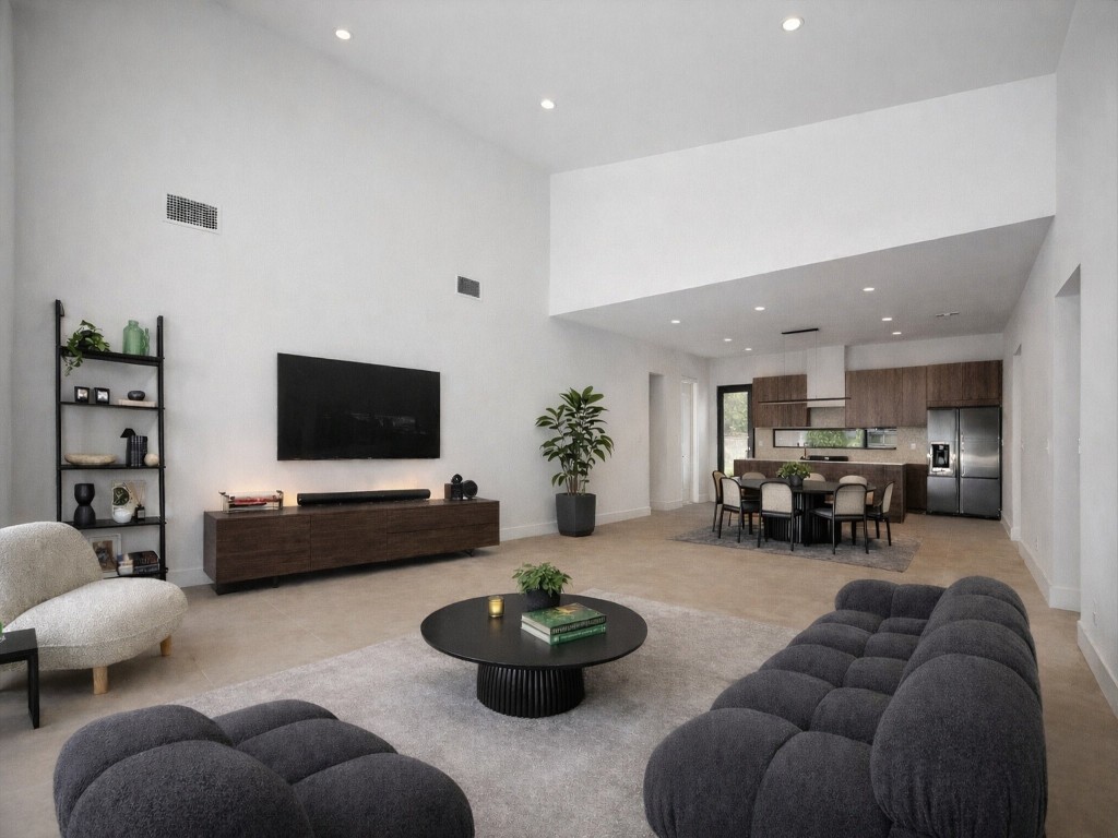 10943 Mockingbird Place Conroe, TX 77385 - Photo 3 of 24 a living room with furniture and a flat screen tv