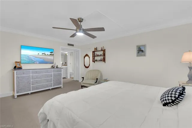 a bedroom with a bed and cabinets