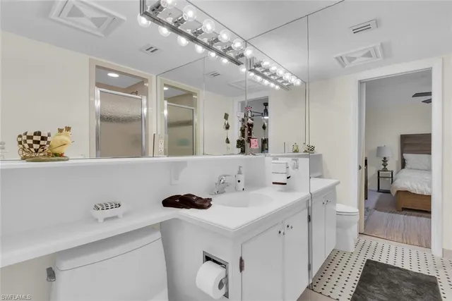 a bathroom with a sink a vanity and a mirror