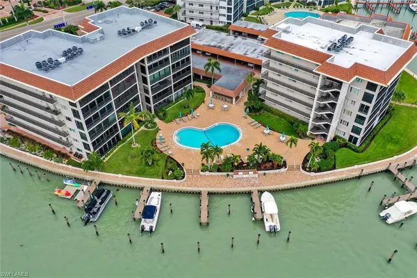 an aerial view of a house with outdoor space
