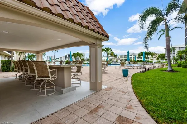 a patio with a table and chairs
