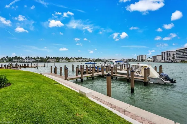 a view of a lake with houses in the back