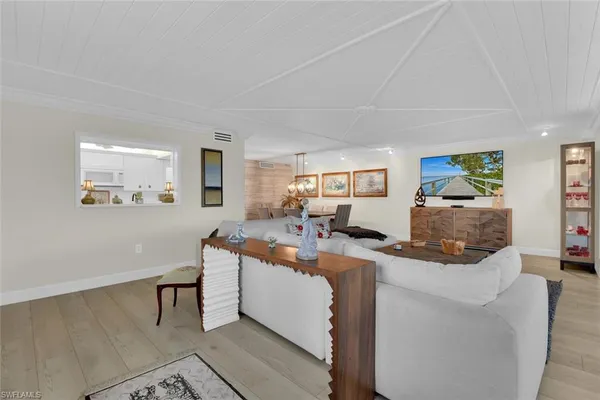 a view of a living room and dining room