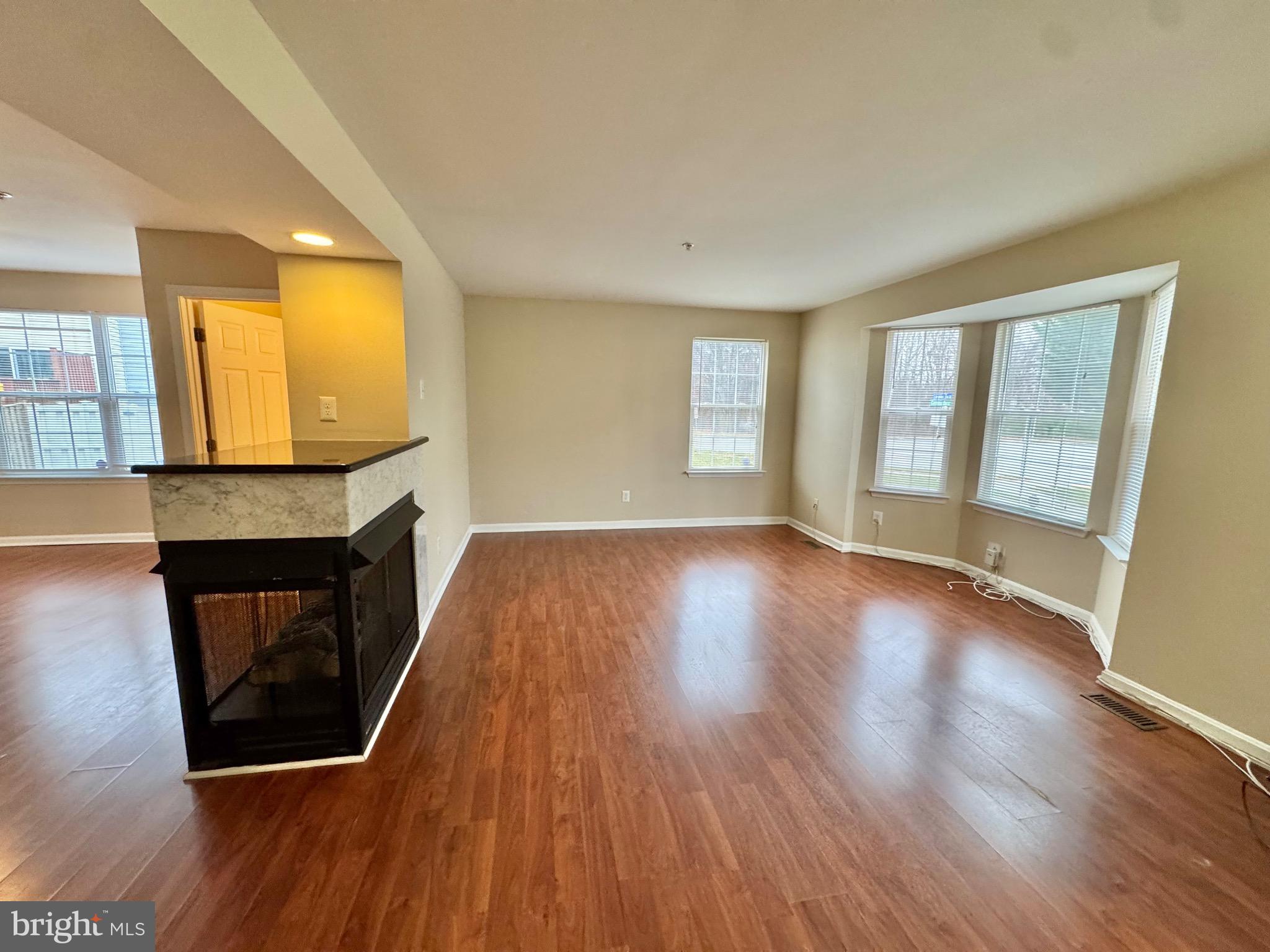 211 Langdon Farm Circle Odenton, MD 21113 - Photo 6 of 38 LIVING ROOM WINDOWS BRING IN NATURAL SUNLIGHT