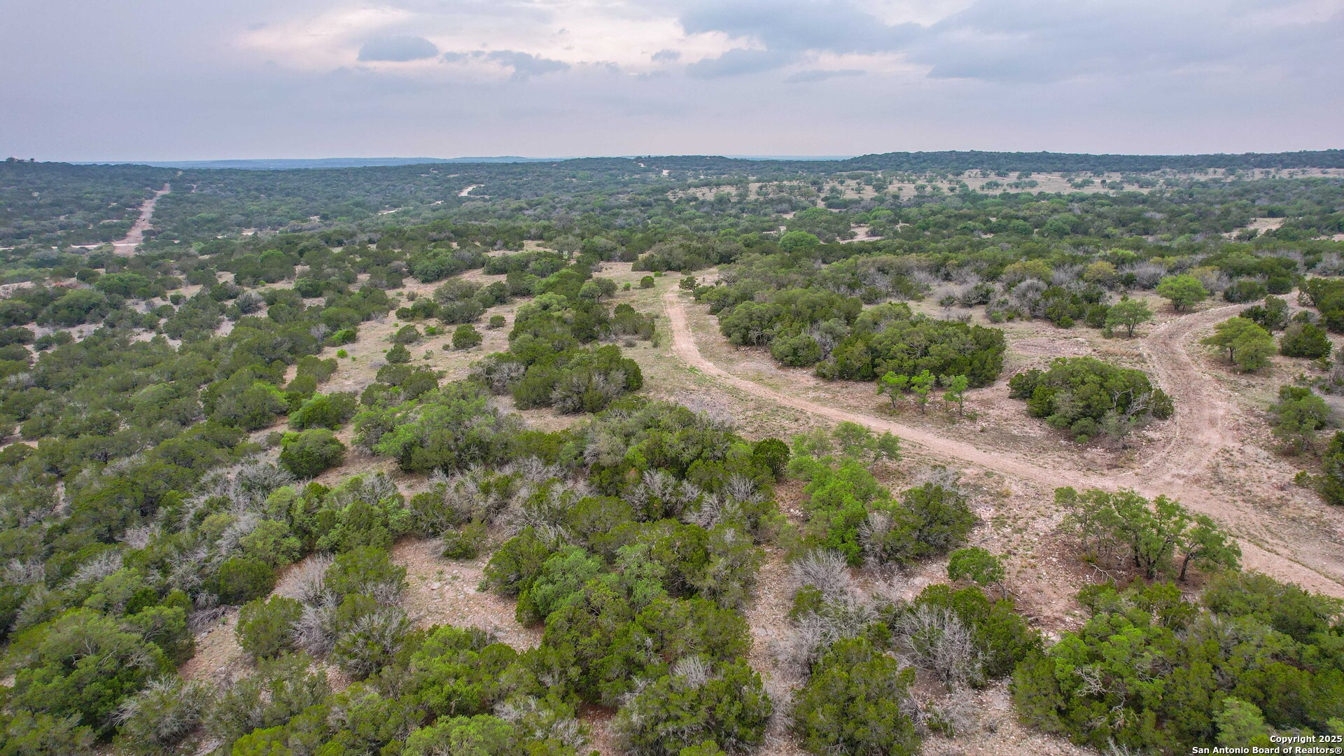 0 Cr 140 Junction Junction, TX 76849 - Photo 12 of 21 an aerial view of residential houses with outdoor space and trees