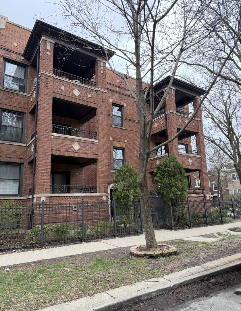 4546 North Spaulding Avenue, Unit 1 Chicago, IL 60625 - Photo 1 of 22 a front view of a house with garage