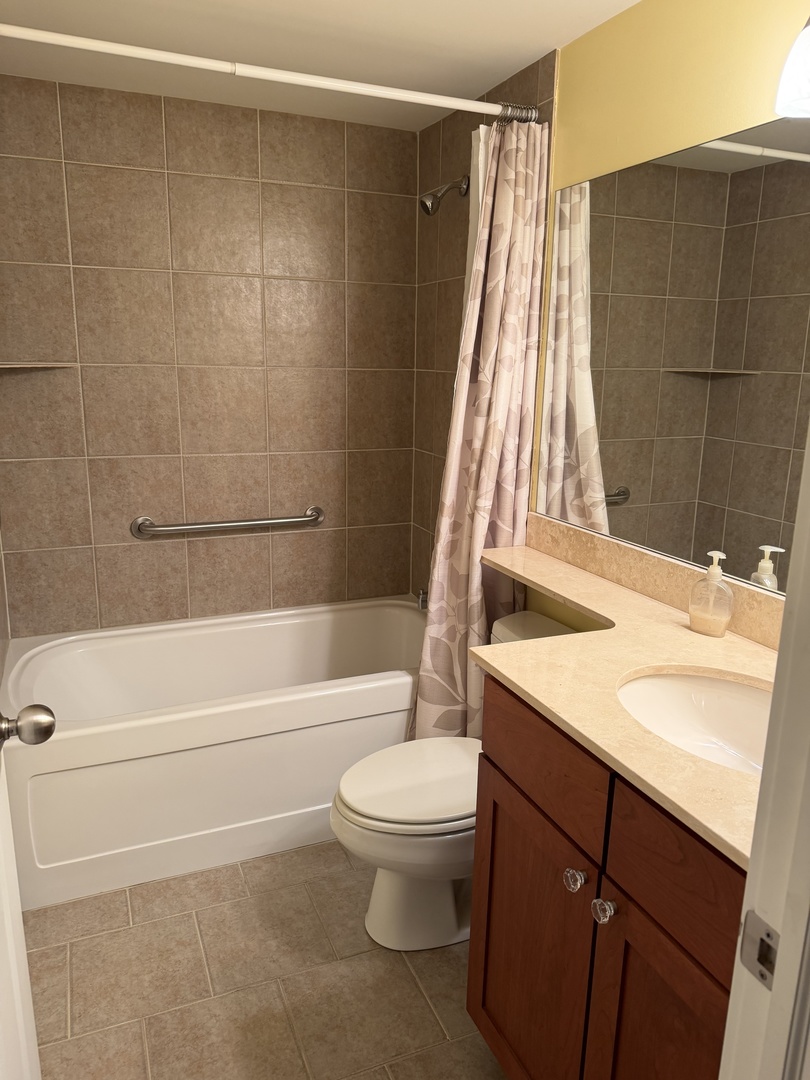 4546 North Spaulding Avenue, Unit 1 Chicago, IL 60625 - Photo 13 of 22 a bathroom with a sink a toilet and shower