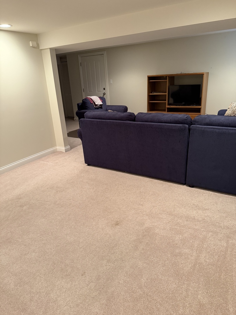 4546 North Spaulding Avenue, Unit 1 Chicago, IL 60625 - Photo 18 of 22 a living room with furniture and a flat screen tv