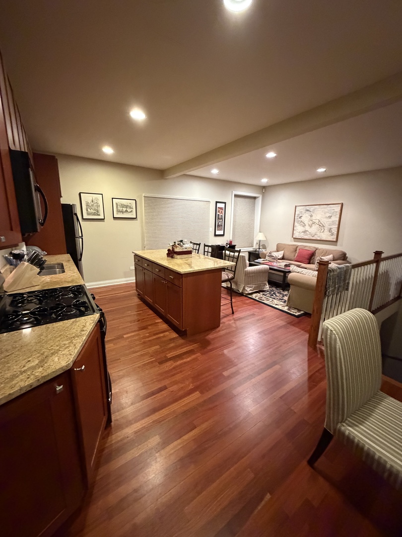 4546 North Spaulding Avenue, Unit 1 Chicago, IL 60625 - Photo 4 of 22 a living room with furniture and a flat screen tv