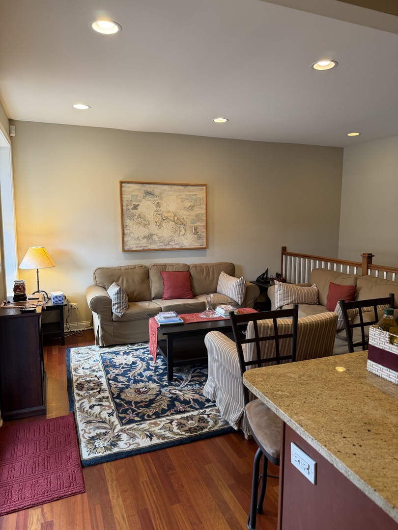 4546 North Spaulding Avenue, Unit 1 Chicago, IL 60625 - Photo 9 of 22 a living room with furniture and a rug