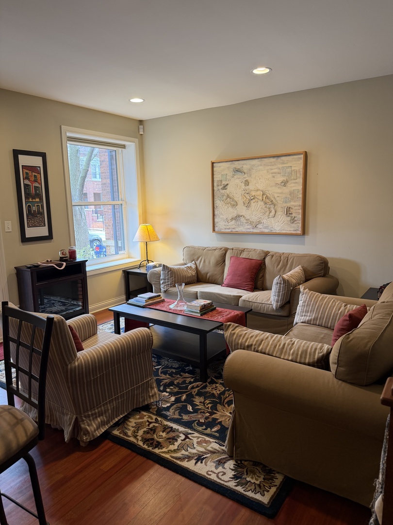 4546 North Spaulding Avenue, Unit 1 Chicago, IL 60625 - Photo 10 of 22 a living room with furniture and a window