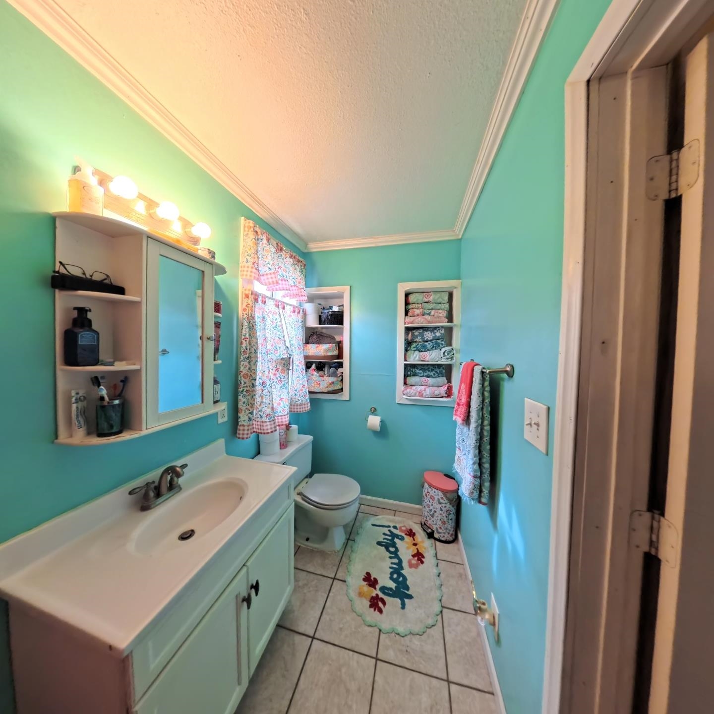 1209 Watson Street Streator, IL 61364 - Photo 15 of 15 a bathroom with a sink mirror vanity and toilet
