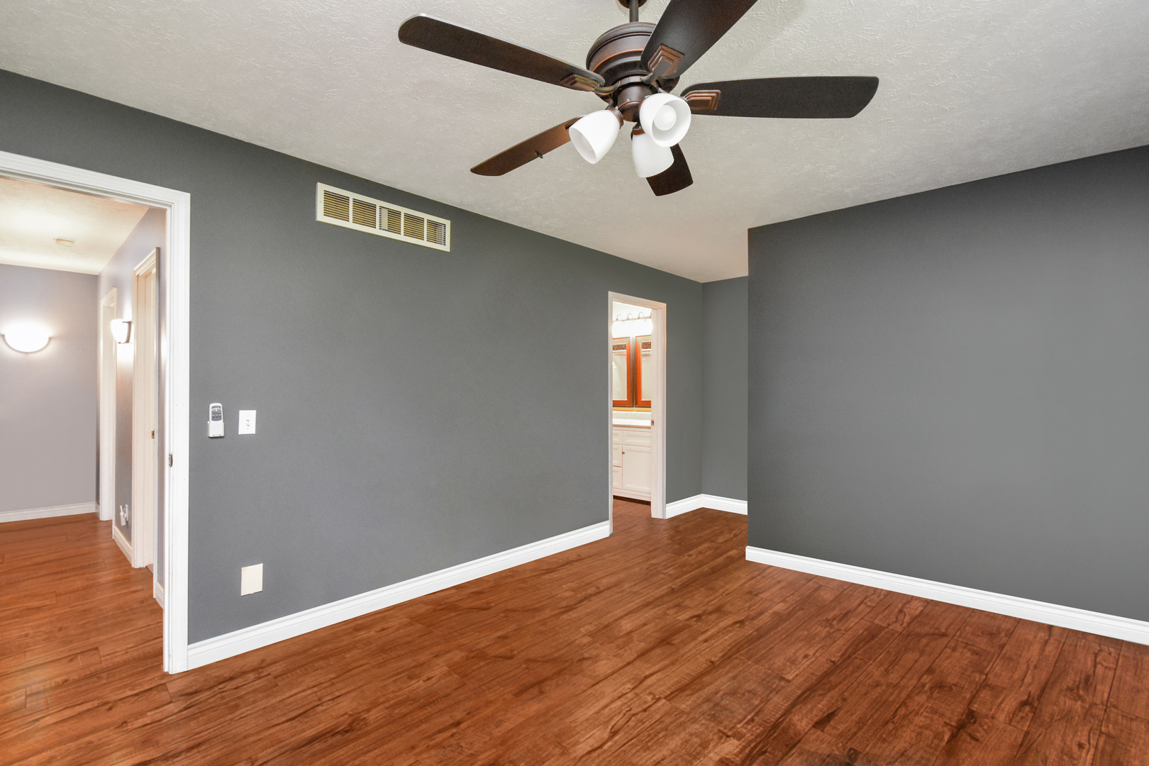 604 Morningside Drive Chenoa, IL 61726 - Photo 12 of 33 wooden floor in an empty room with a window