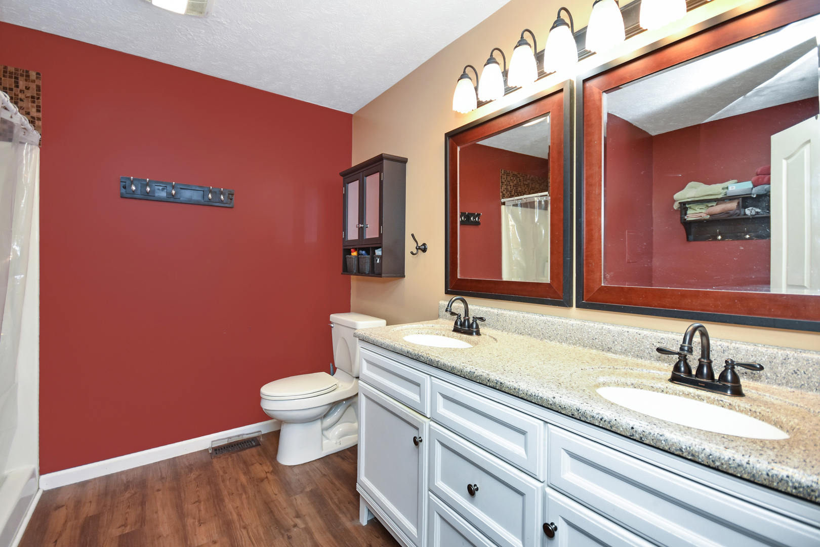 604 Morningside Drive Chenoa, IL 61726 - Photo 14 of 33 a bathroom with a granite countertop toilet and a sink