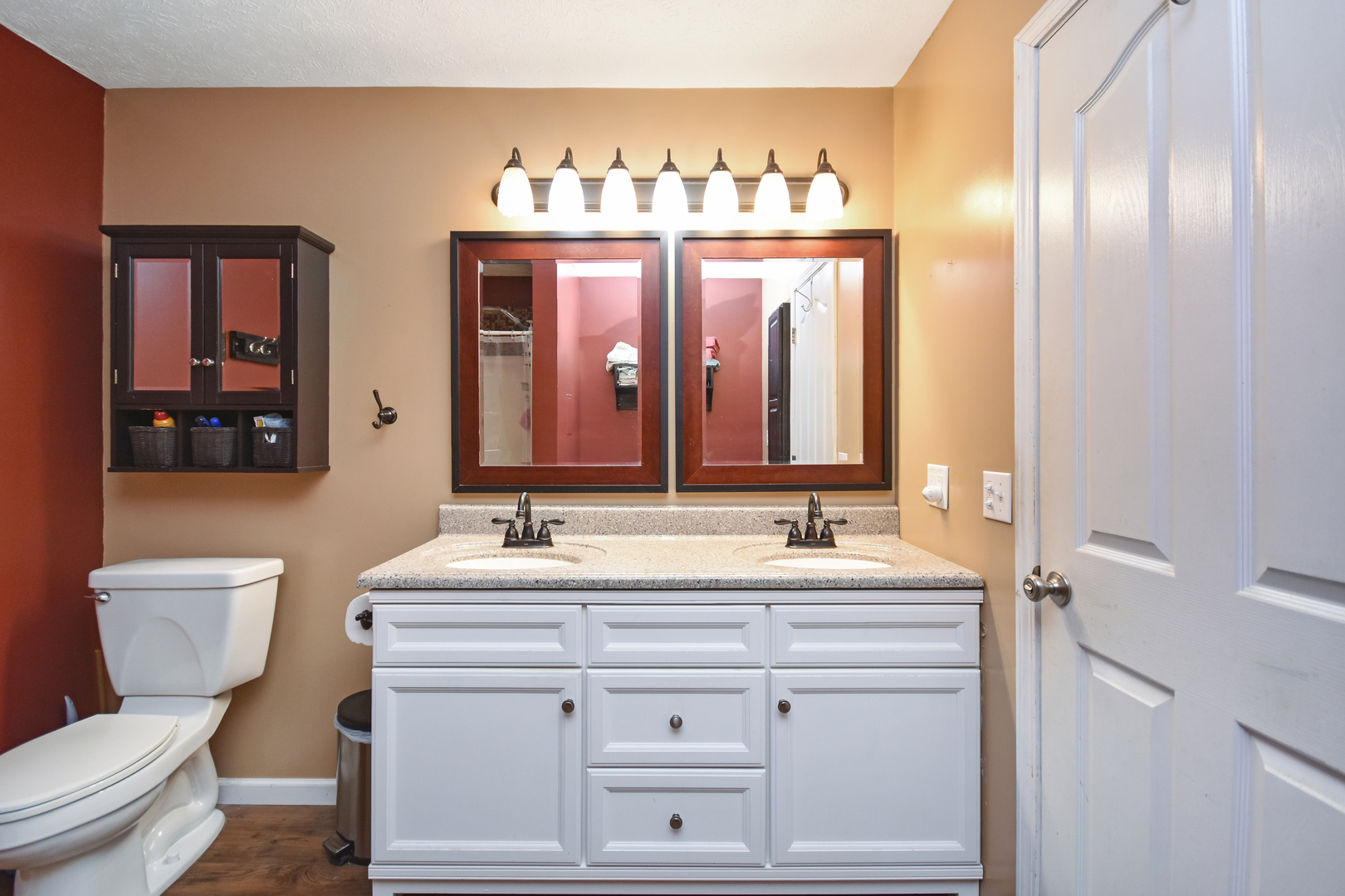604 Morningside Drive Chenoa, IL 61726 - Photo 15 of 33 a bathroom with a double vanity sink toilet and a mirror