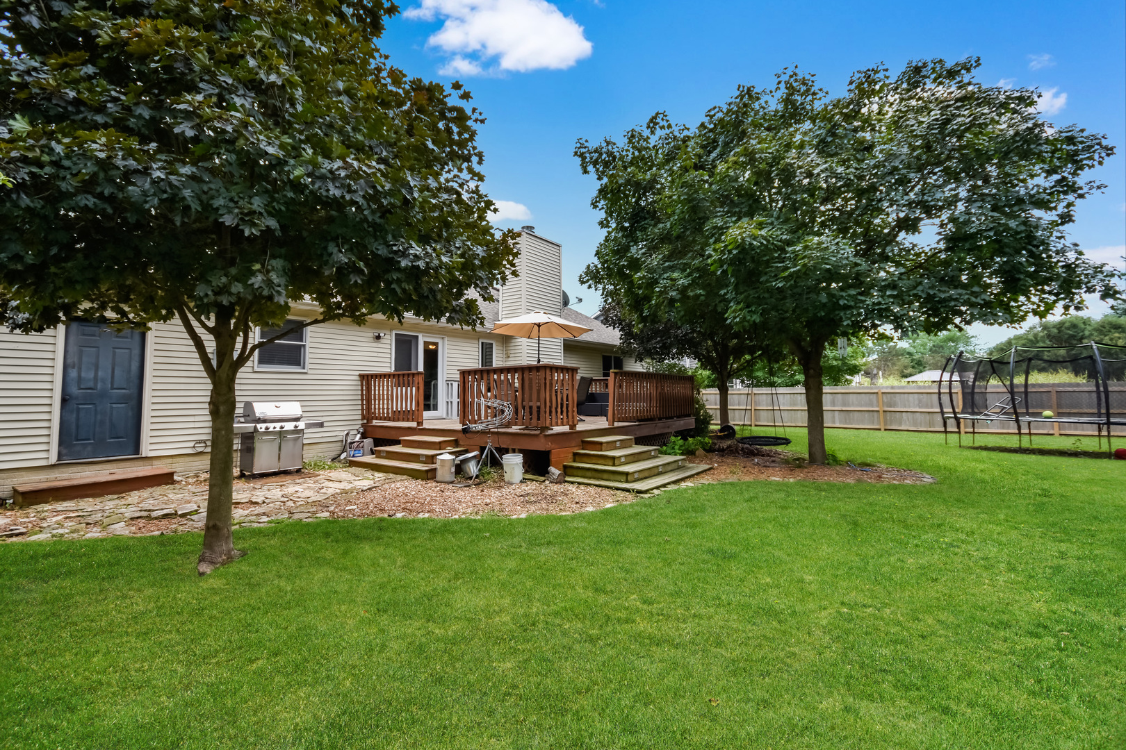 604 Morningside Drive Chenoa, IL 61726 - Photo 30 of 33 a view of a backyard with table and chairs and a tree