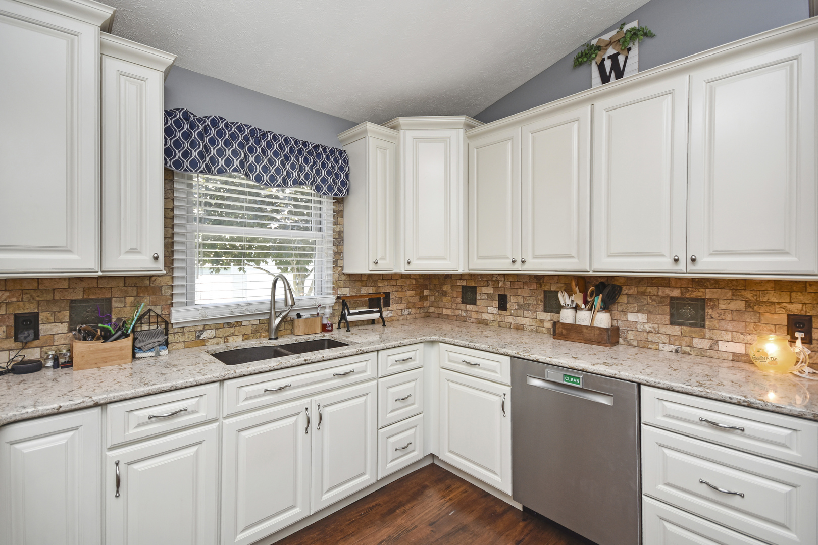 604 Morningside Drive Chenoa, IL 61726 - Photo 7 of 33 a kitchen with sink cabinets and window