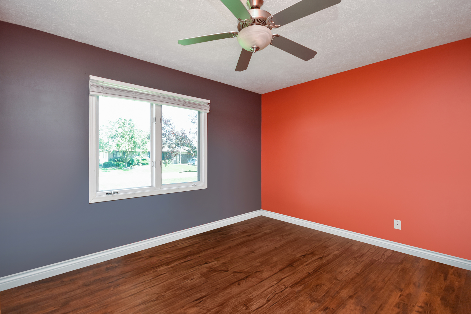 604 Morningside Drive Chenoa, IL 61726 - Photo 9 of 33 an empty room with wooden floor fan and windows