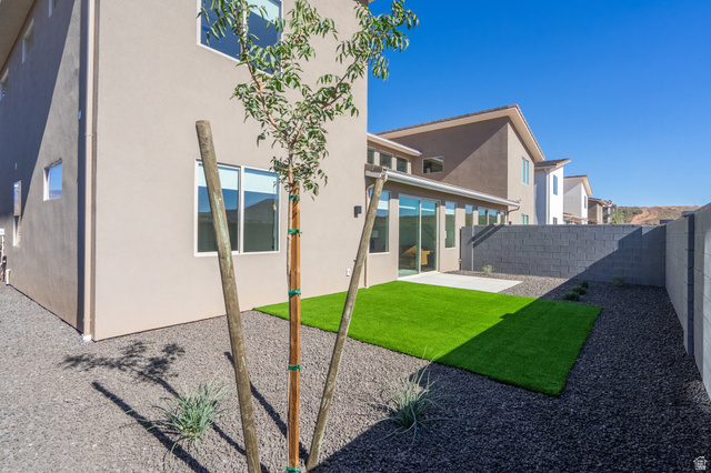 2972 West 570 North Hurricane, UT 84737 - Photo 81 of 104 Rear view of house featuring a patio area, a fenced backyard, and stucco siding