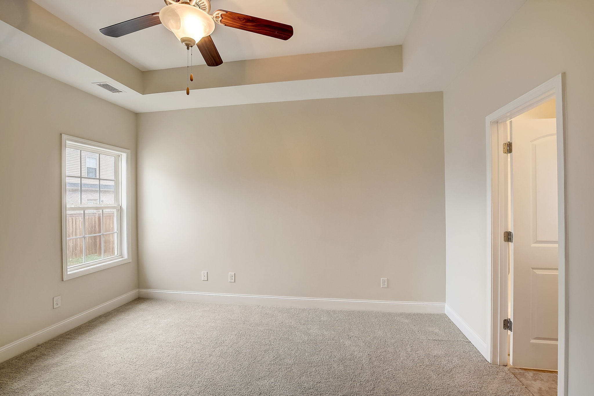 1028 Grace Road Pleasant View, TN 37015 - Photo 12 of 21 an empty room with windows and fan