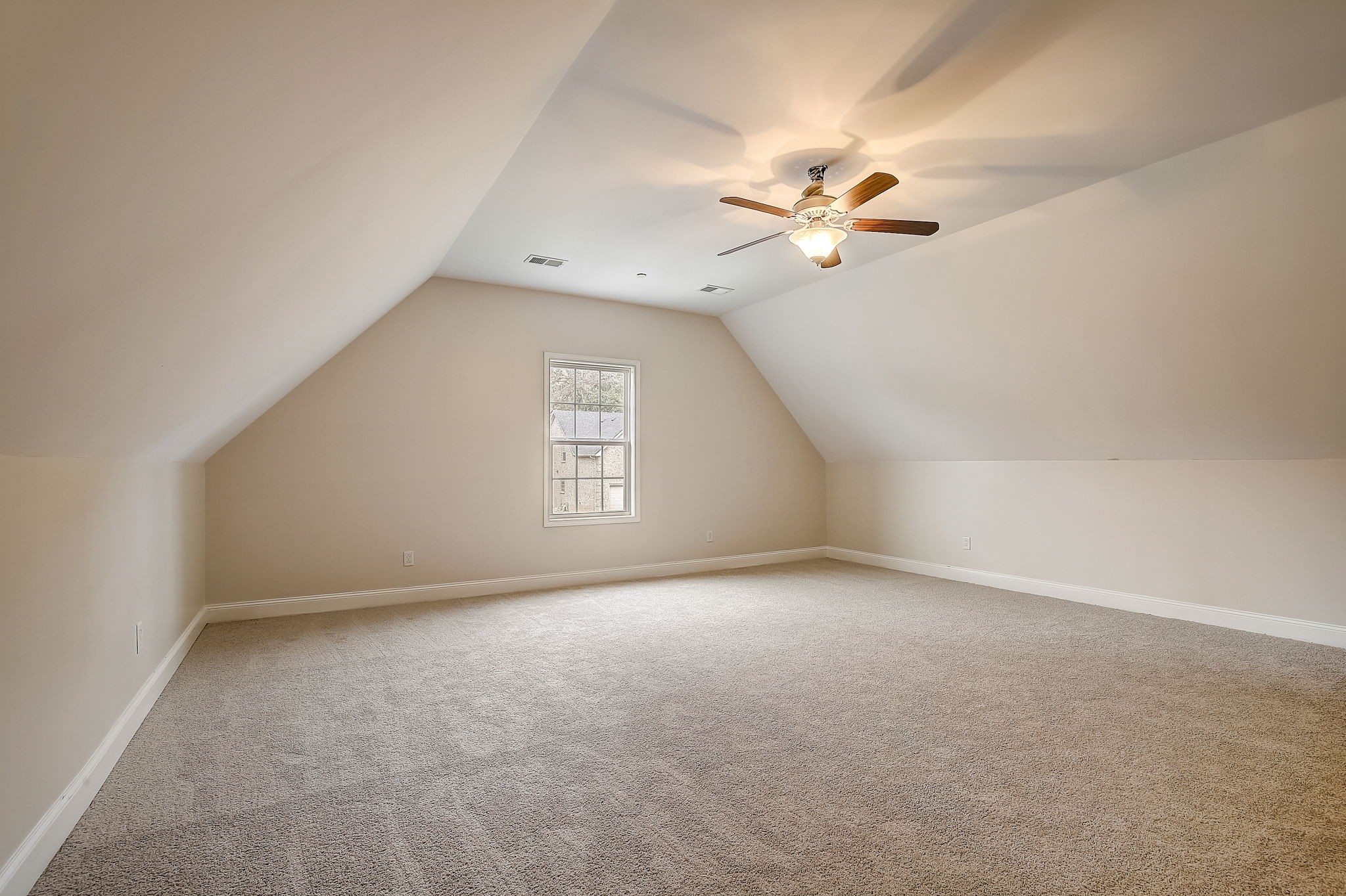1028 Grace Road Pleasant View, TN 37015 - Photo 18 of 21 an empty room with a window and a ceiling fan