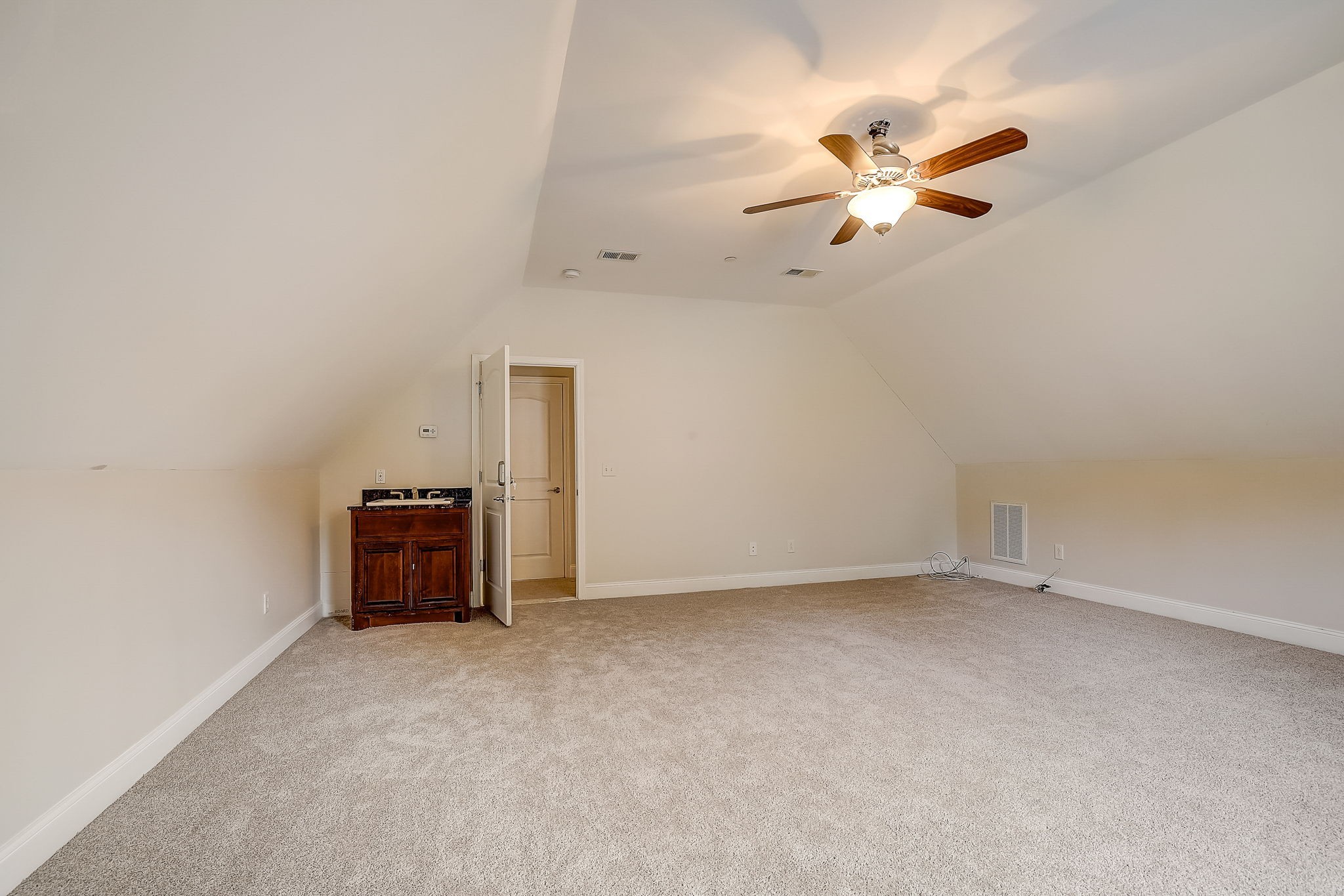 1028 Grace Road Pleasant View, TN 37015 - Photo 19 of 21 an empty room with closet and fan