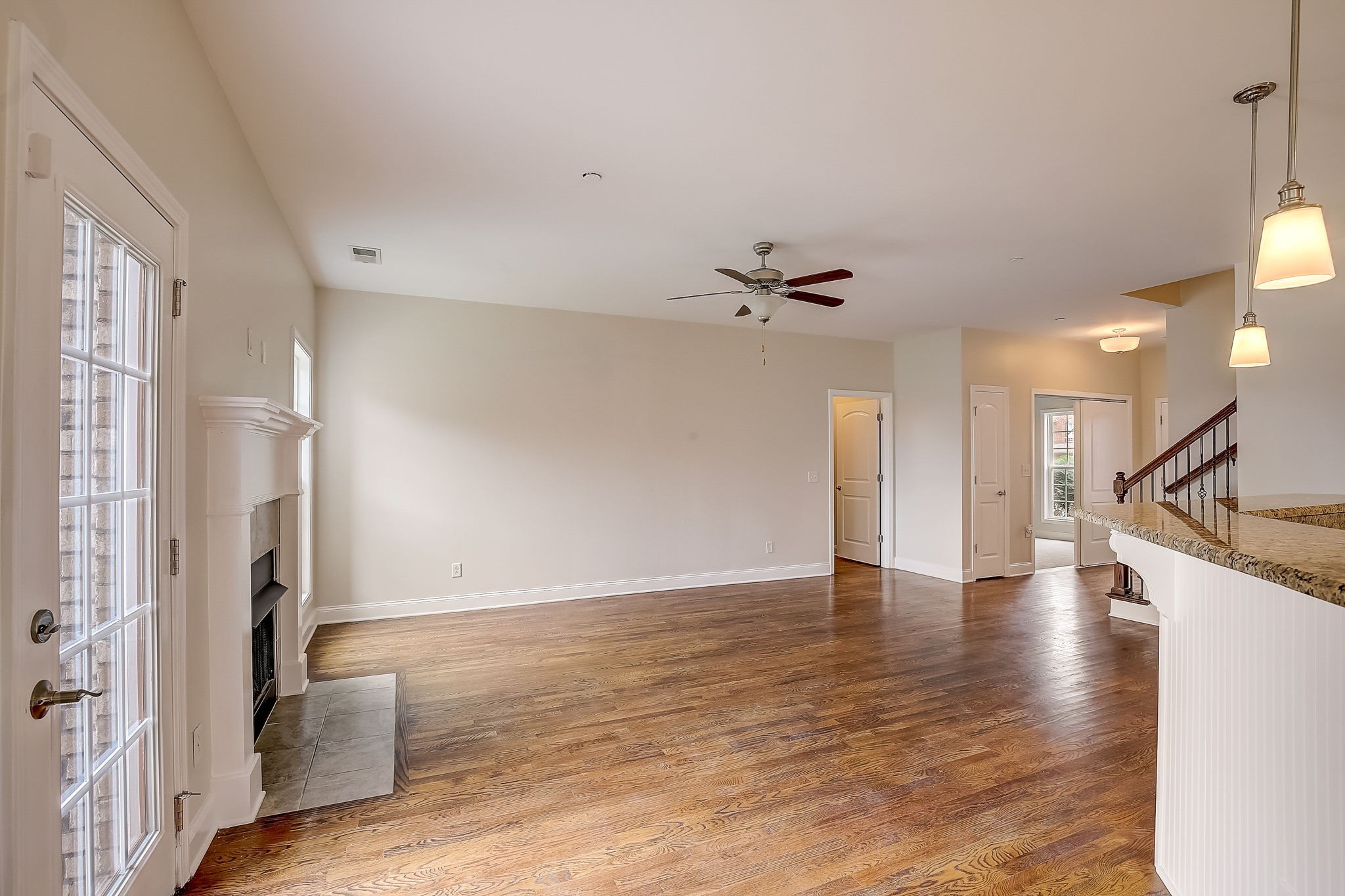 1028 Grace Road Pleasant View, TN 37015 - Photo 4 of 21 a view of an empty room with wooden floor and a window