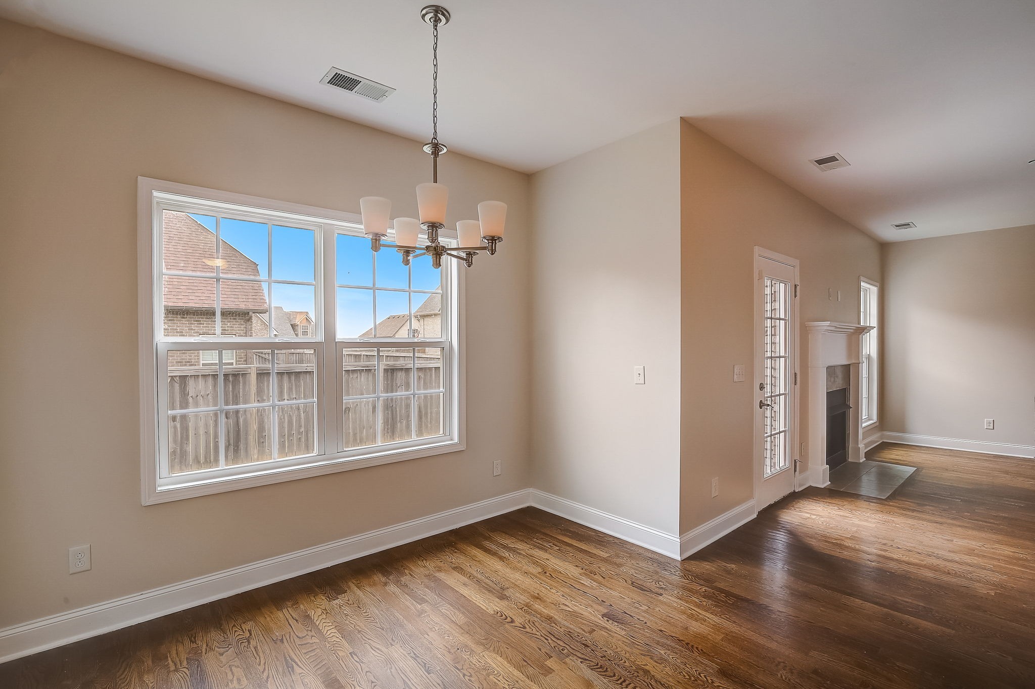 1028 Grace Road Pleasant View, TN 37015 - Photo 5 of 21 a view of an empty room with a window and wooden floor