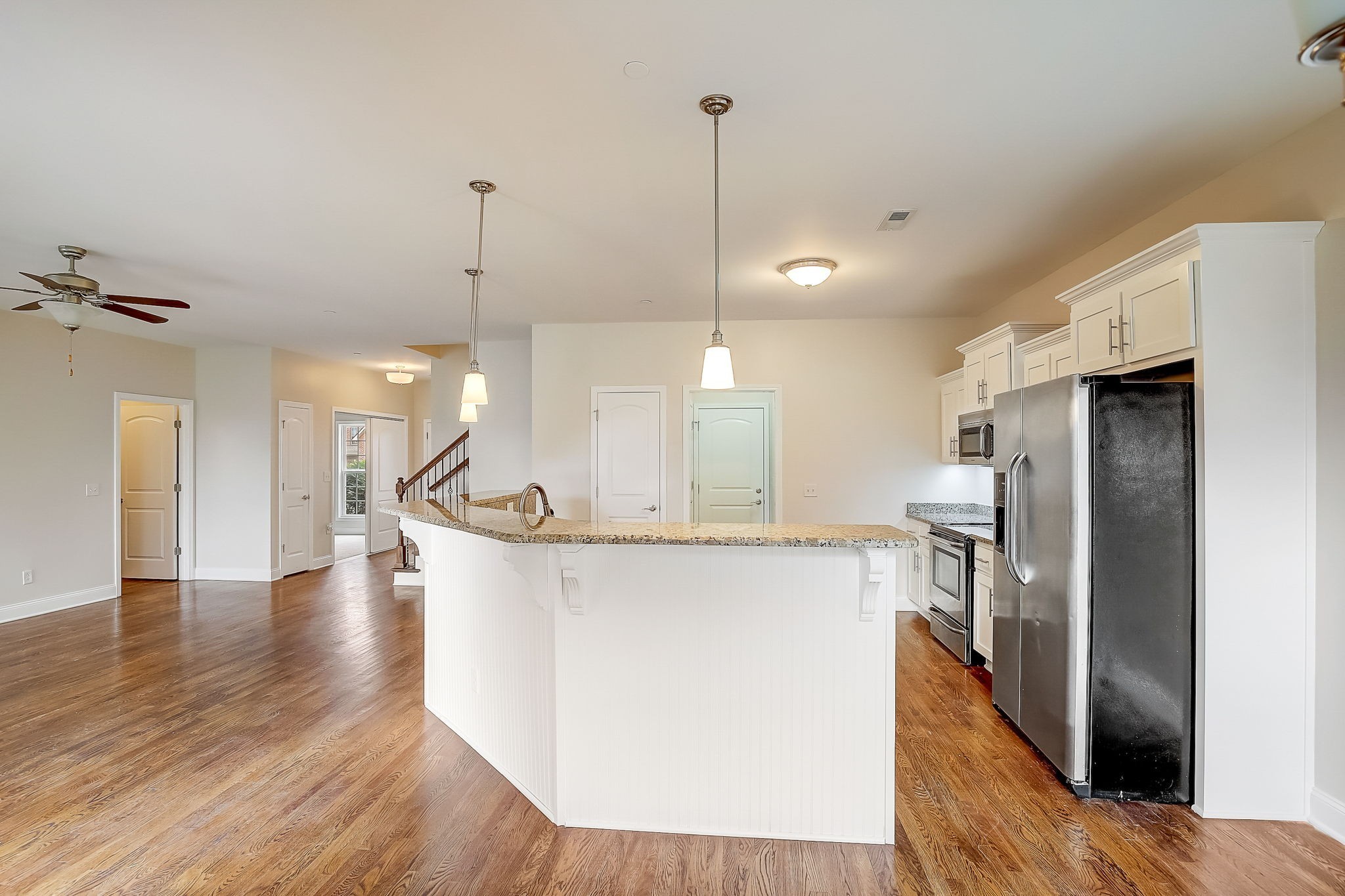 1028 Grace Road Pleasant View, TN 37015 - Photo 6 of 21 a view of a kitchen with kitchen island a counter top space a sink appliances and a refrigerator