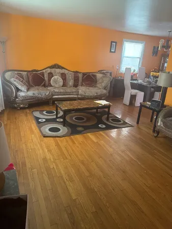 a view of kitchen with furniture and wooden floor