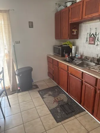a kitchen with a cabinets and window