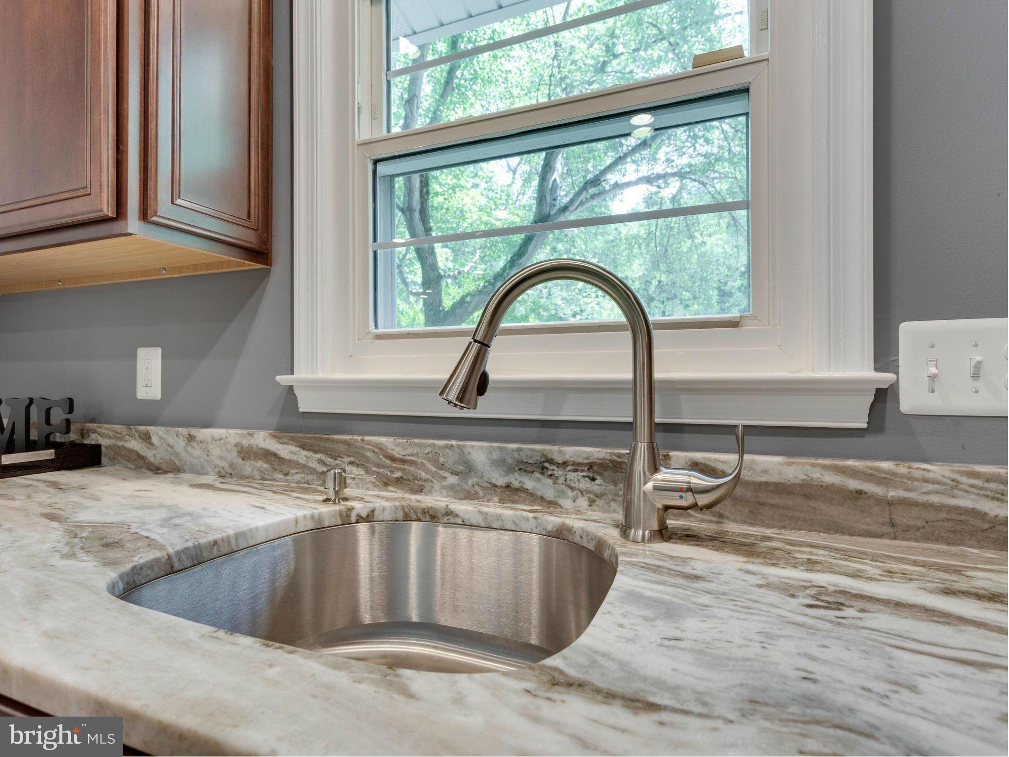 7120 Dryburgh Court Springfield, VA 22152 - Photo 11 of 30 Kitchen Sink with Window That Looks Out to Trees