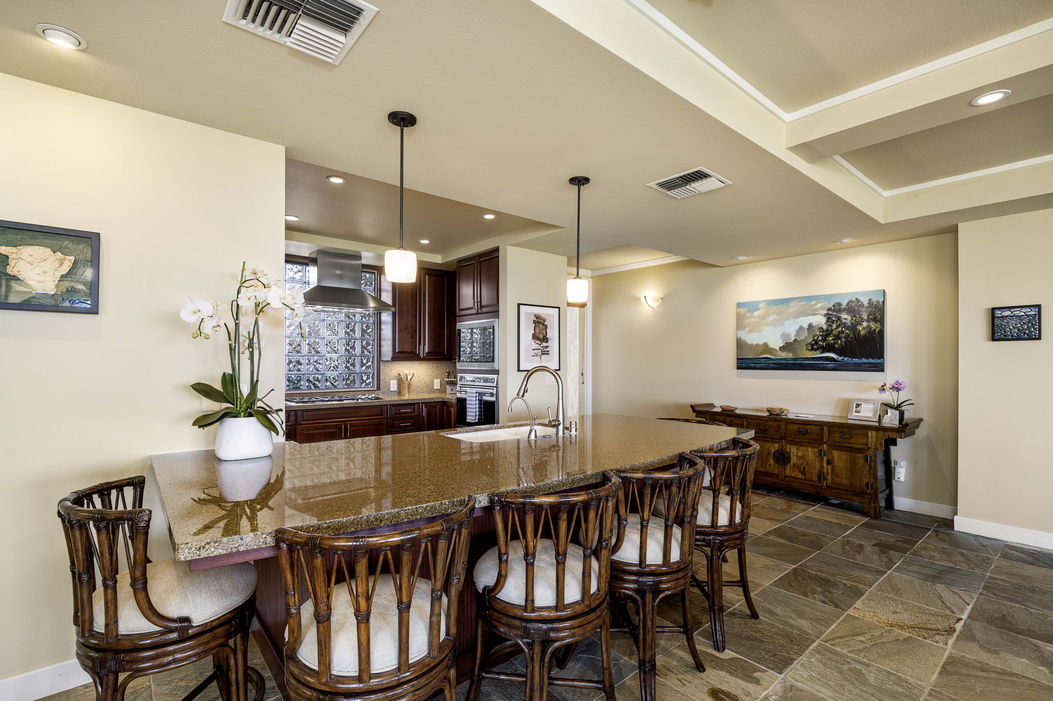62-3600 Amaui Place, Unit F102 Kamuela, HI 96743 - Photo 13 of 27 a dining room with furniture a rug and chandelier