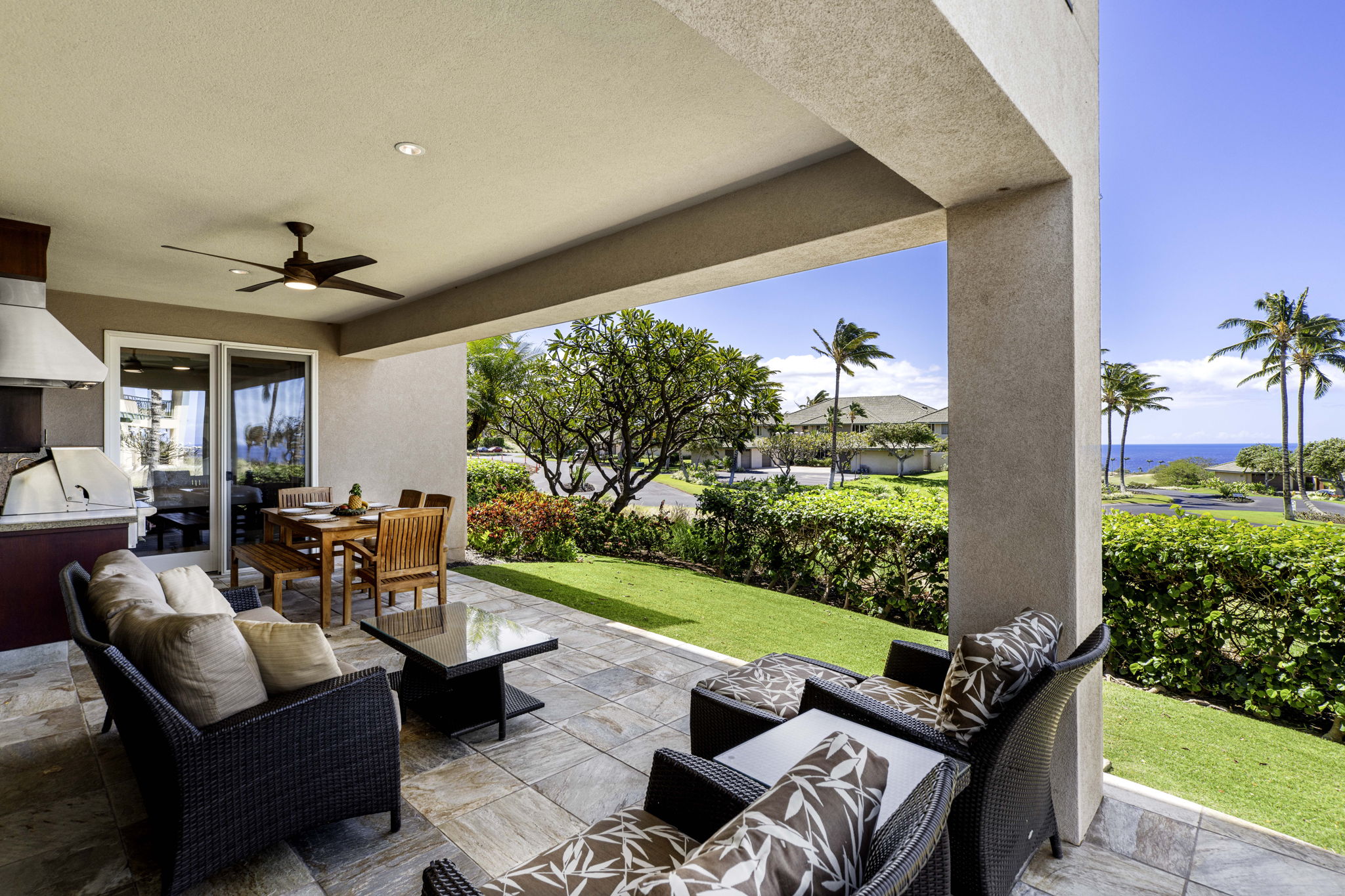 62-3600 Amaui Place, Unit F102 Kamuela, HI 96743 - Photo 18 of 27 a outdoor living space with furniture potted plant and a garden