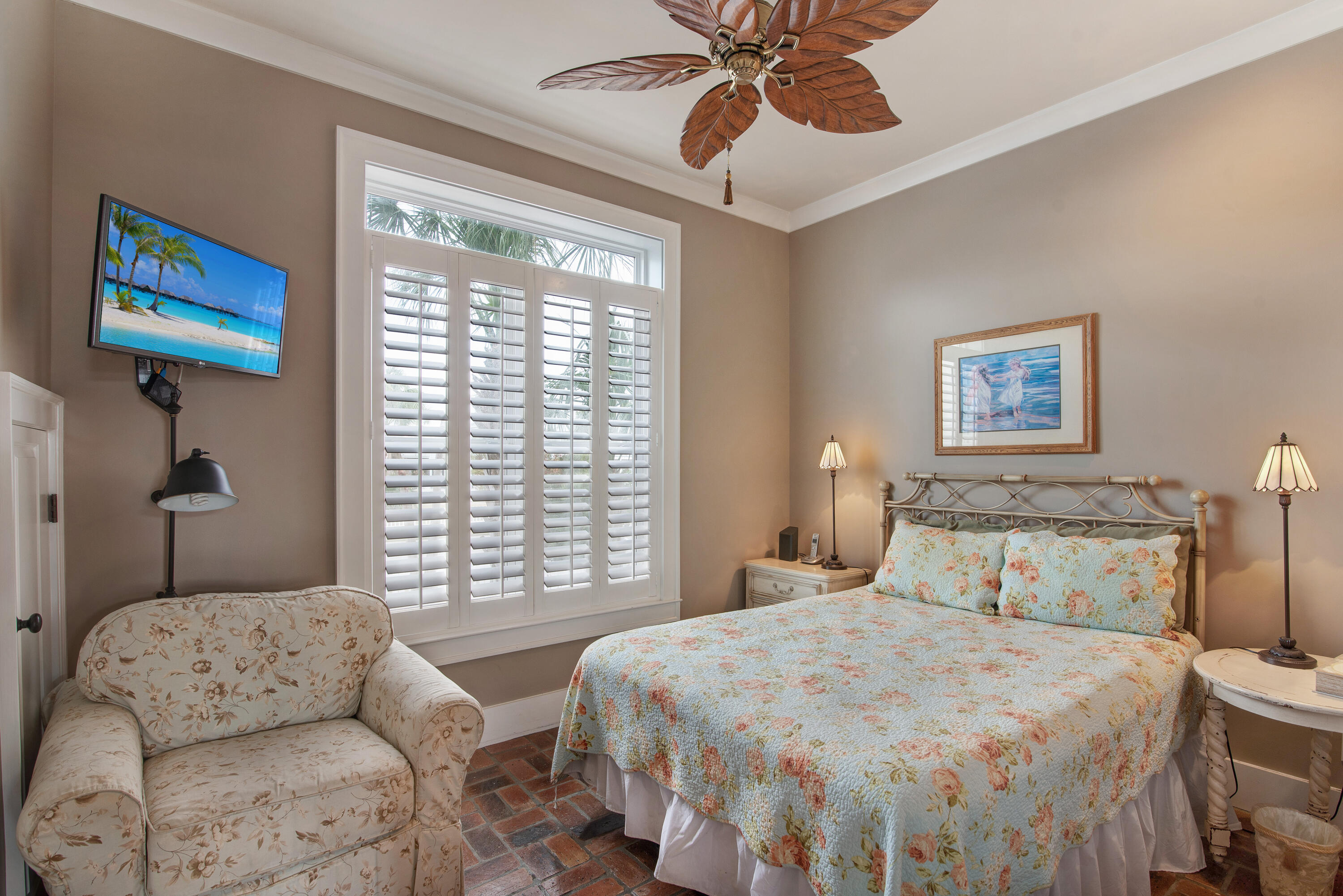 4484 Ocean View Drive Destin, FL 32541 - Photo 11 of 40 a bedroom with a bed and a chandelier