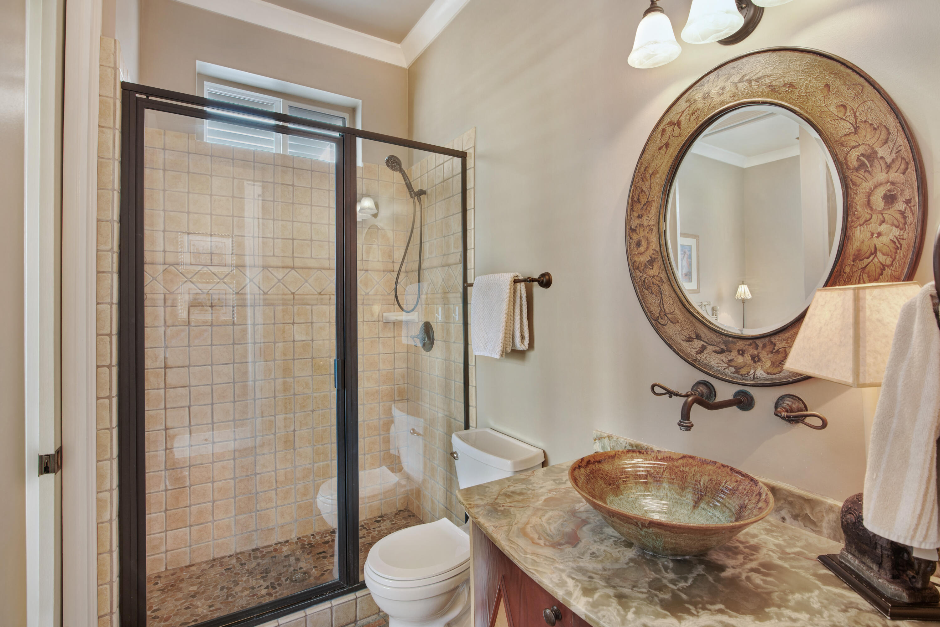 4484 Ocean View Drive Destin, FL 32541 - Photo 13 of 40 a bathroom with a sink a toilet and a shower