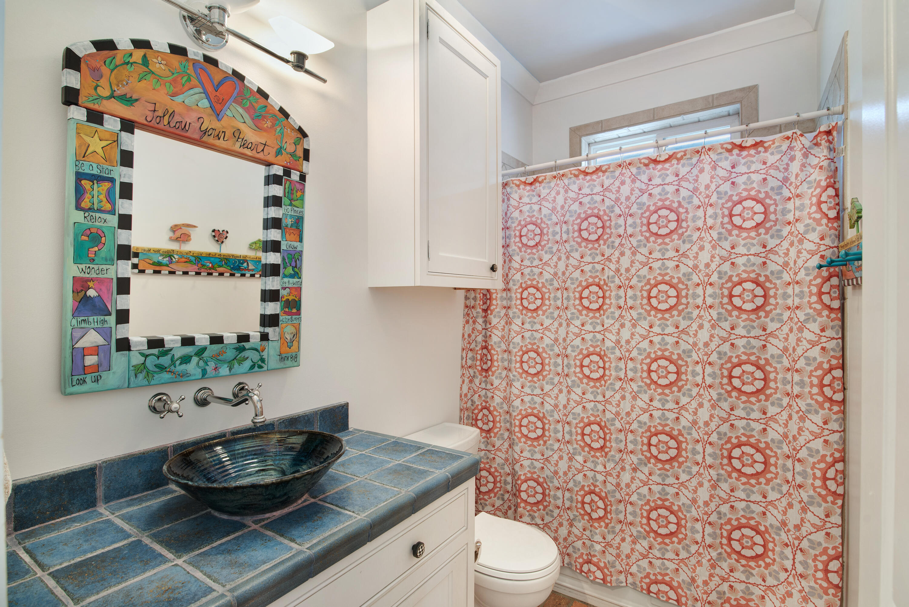 4484 Ocean View Drive Destin, FL 32541 - Photo 18 of 40 a bathroom with a toilet and a shower curtain