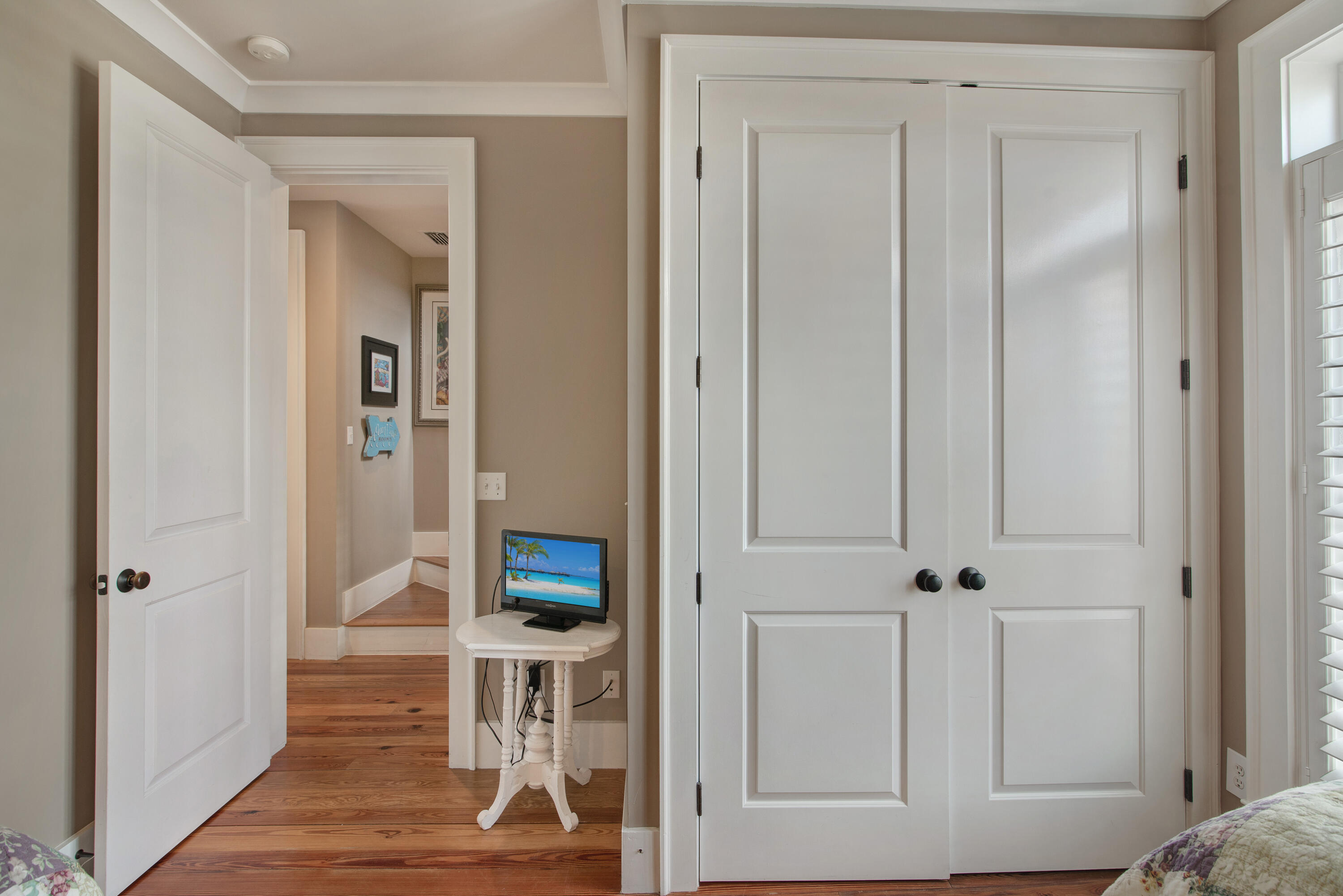 4484 Ocean View Drive Destin, FL 32541 - Photo 19 of 40 a living room with a mirror and a wooden floor