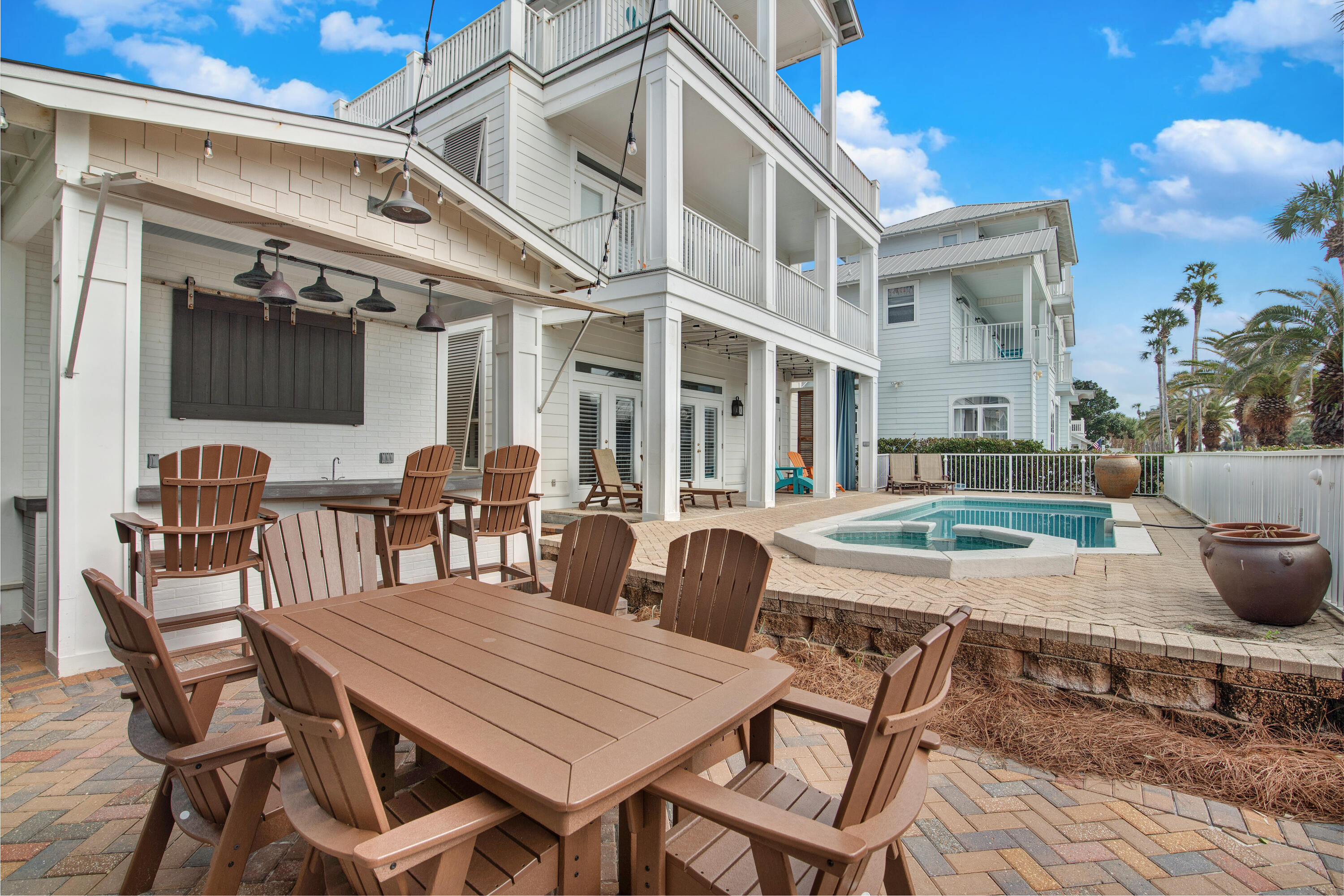 4484 Ocean View Drive Destin, FL 32541 - Photo 2 of 40 a view of a patio with table and chairs and potted plants