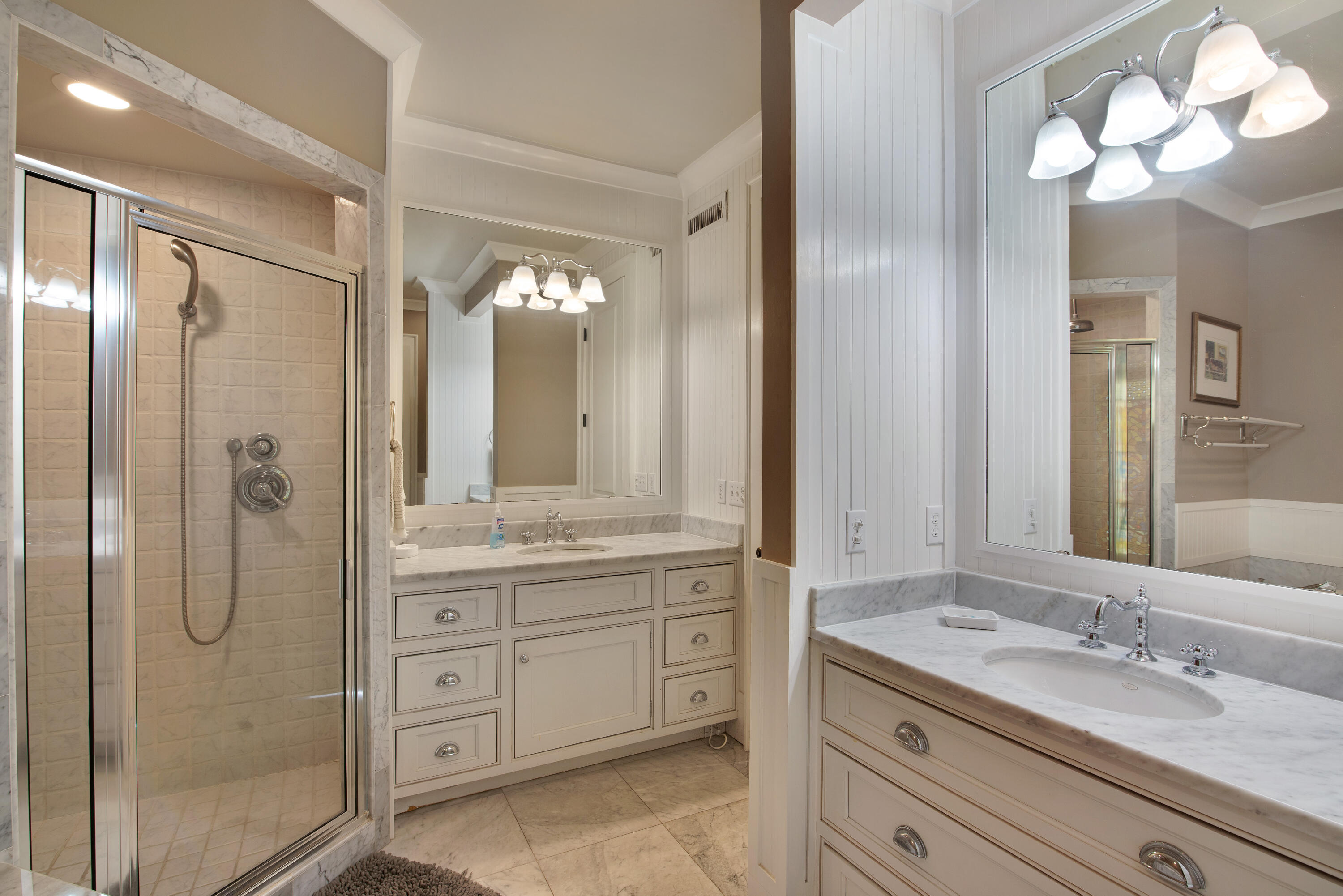 4484 Ocean View Drive Destin, FL 32541 - Photo 22 of 40 a bathroom with a granite countertop sink mirror and a shower