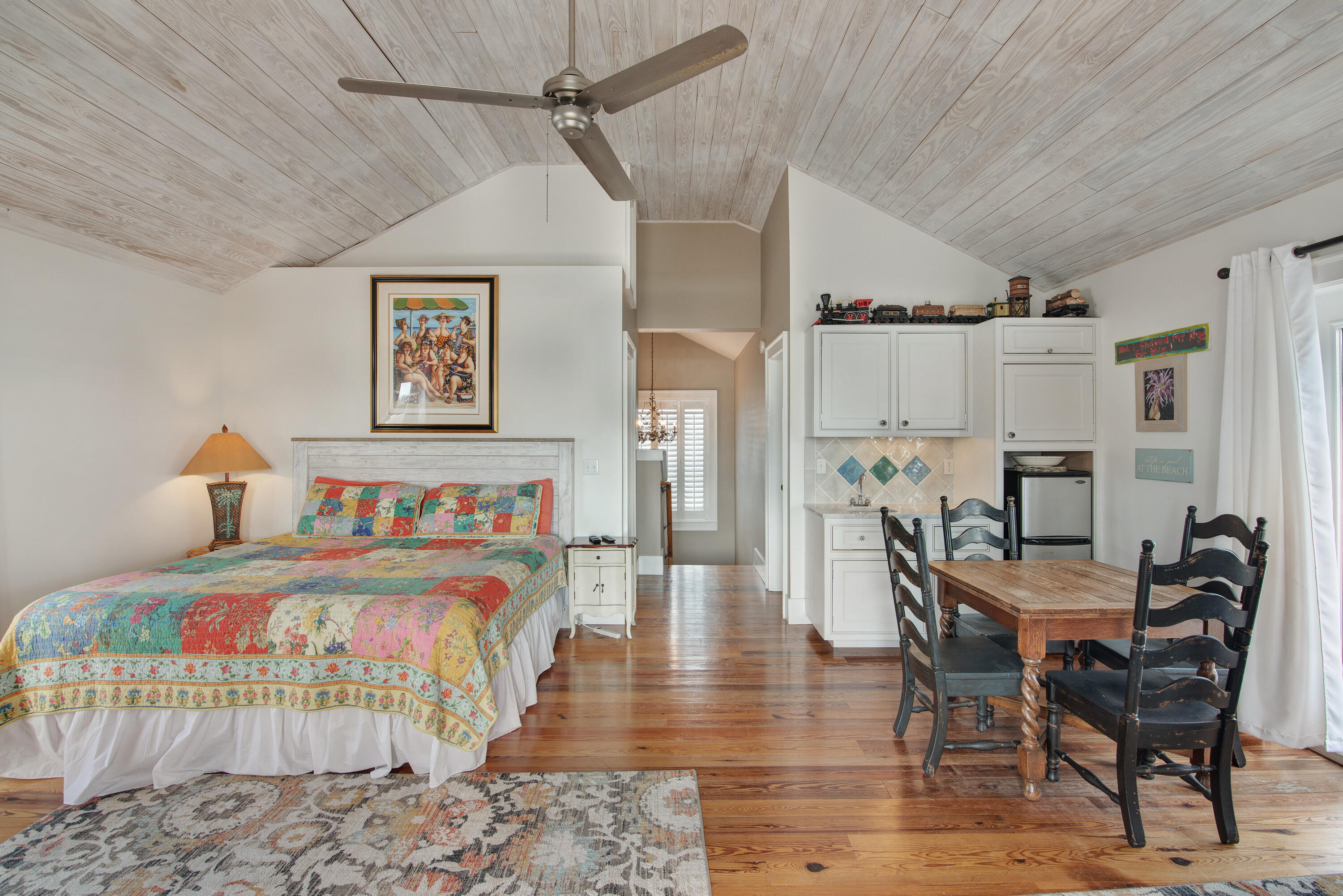 4484 Ocean View Drive Destin, FL 32541 - Photo 30 of 40 a bedroom with furniture and a wooden floor