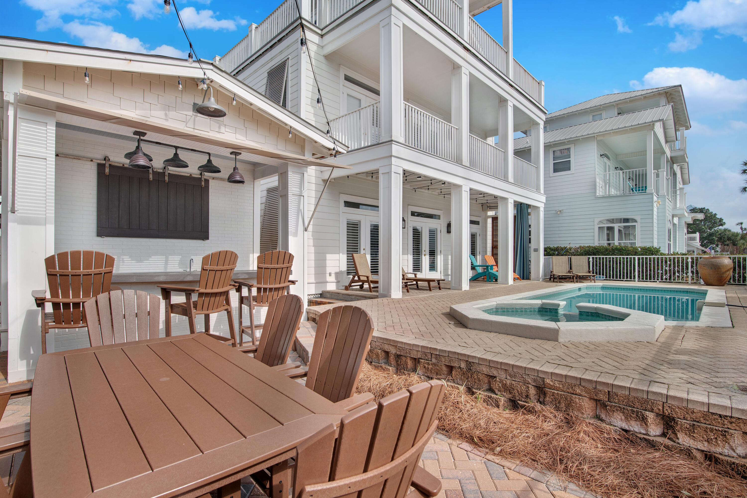 4484 Ocean View Drive Destin, FL 32541 - Photo 32 of 40 a view of a patio with table and chairs