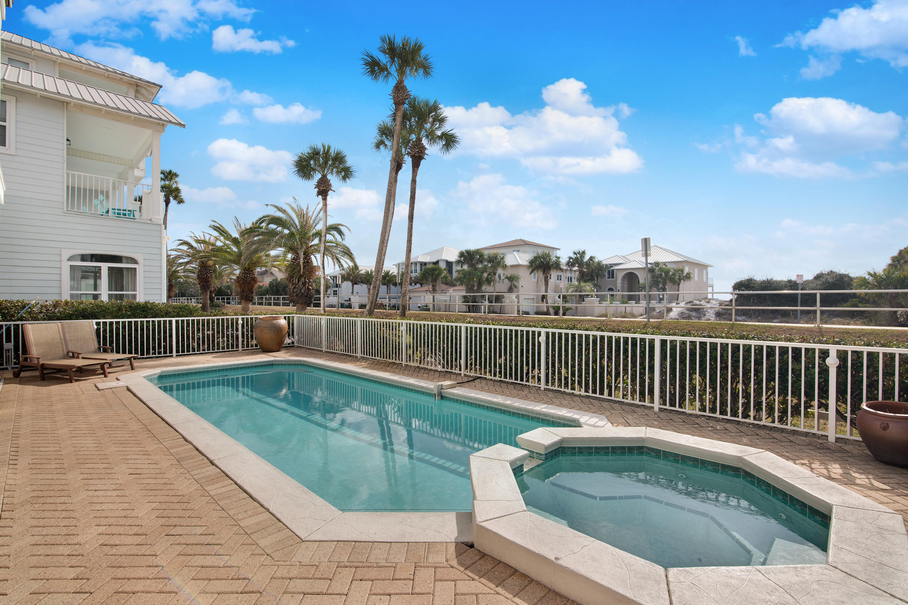 4484 Ocean View Drive Destin, FL 32541 - Photo 35 of 40 a view of a swimming pool with a lounge chair