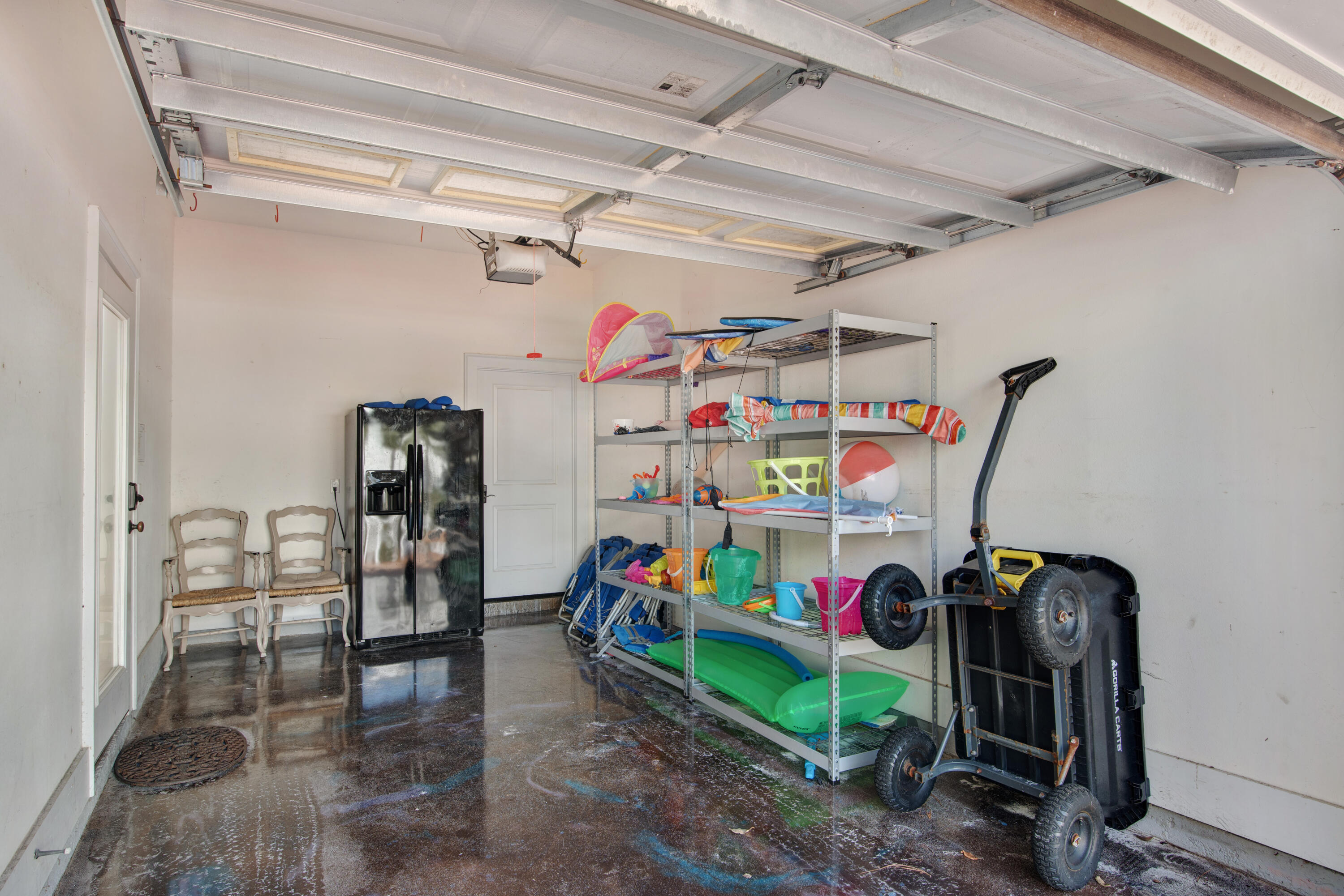 4484 Ocean View Drive Destin, FL 32541 - Photo 39 of 40 a garage with a bike and car