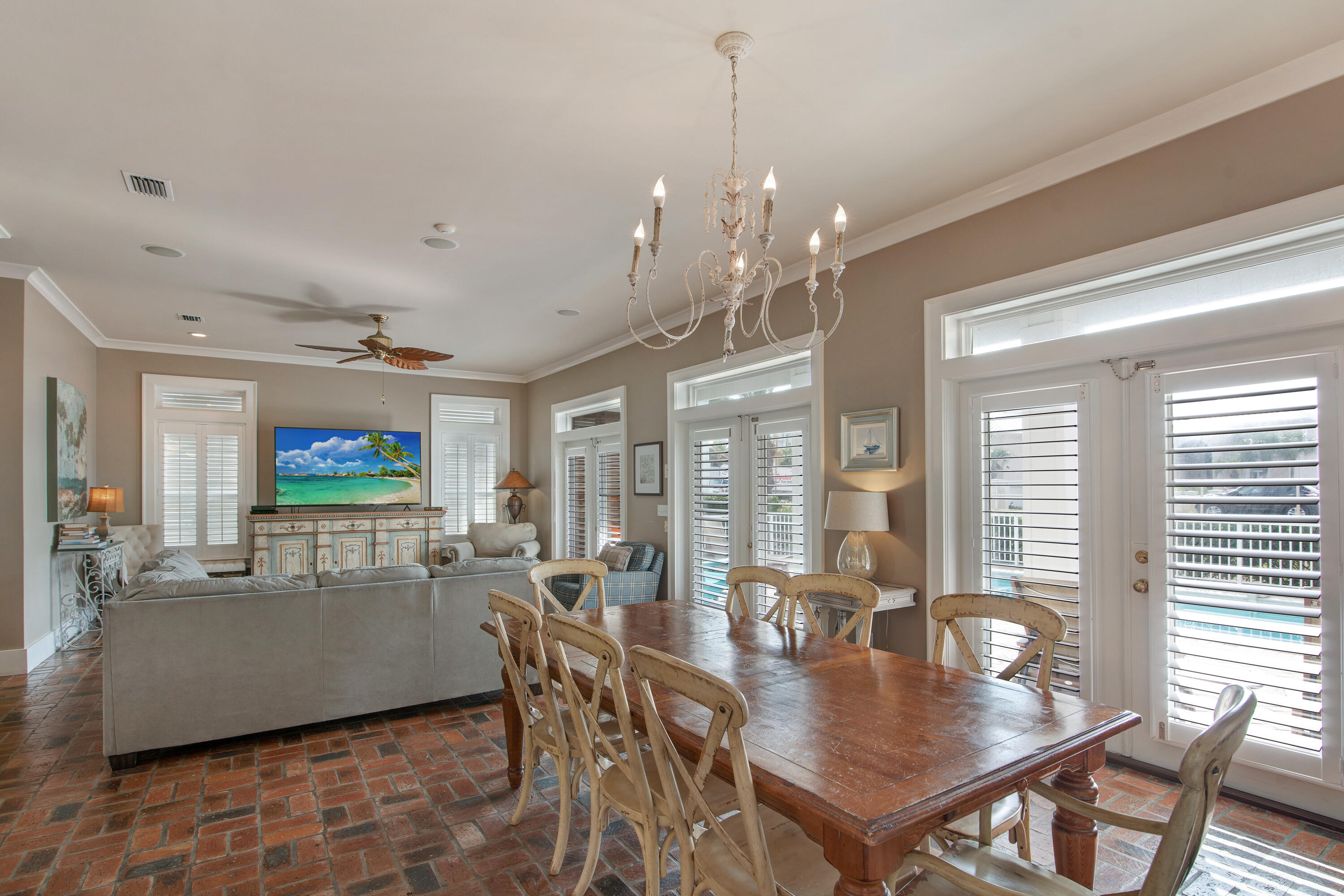 4484 Ocean View Drive Destin, FL 32541 - Photo 4 of 40 a view of a dining room with furniture wooden floor and chandelier