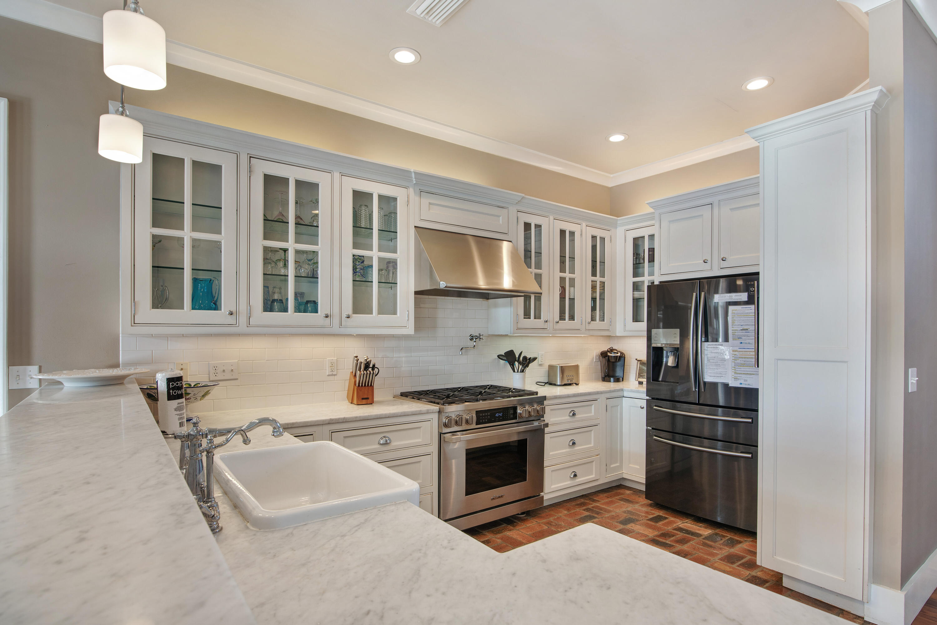 4484 Ocean View Drive Destin, FL 32541 - Photo 7 of 40 a kitchen with stainless steel appliances granite countertop a stove and a refrigerator