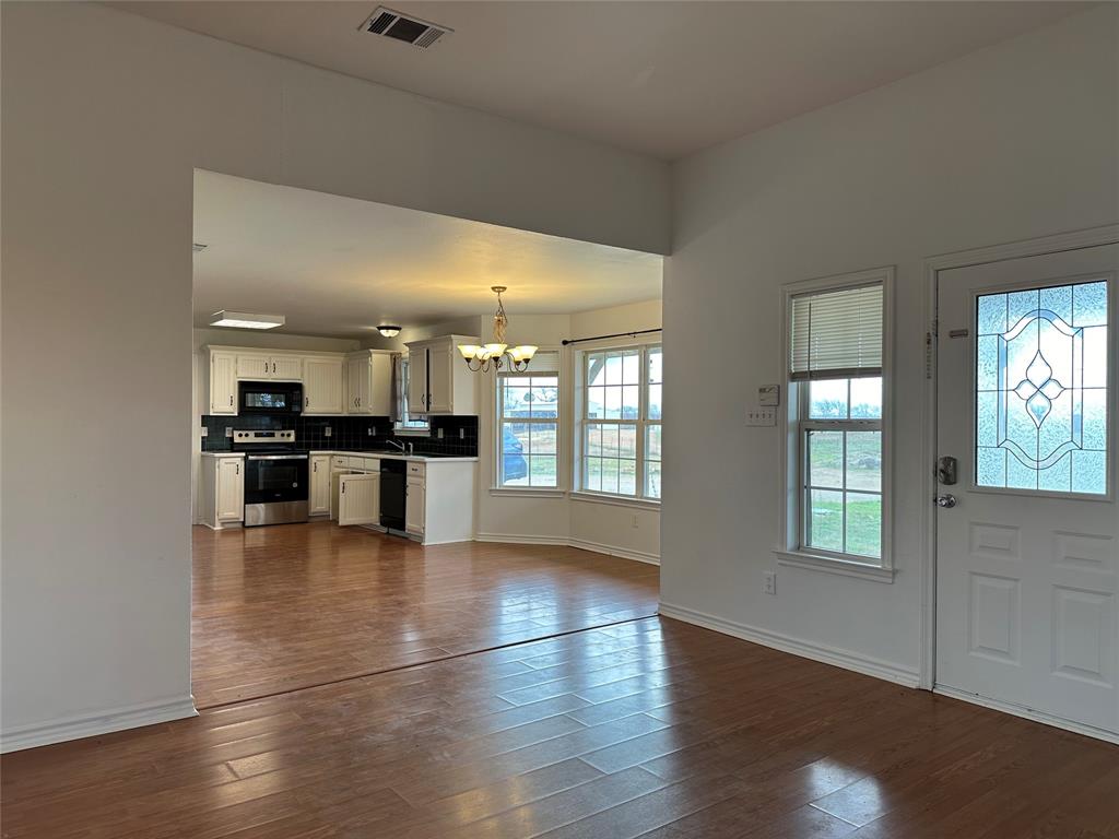 3701 Haynes Road Flower Mound, TX 76262 - Photo 6 of 12 a view of kitchen with cabinets and wooden floor