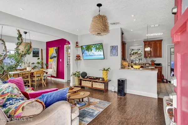 a living room with furniture and a flat screen tv